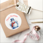 Festive Snowman Christmas Classic Round Sticker<br><div class="desc">Spread the holiday cheer with our festive snowman design! ⛄ Make your Christmas special with this adorable snowman sticker. A cheerful snowman in a cosy red scarf and a winter blue hat sets the perfect tone for a joyful and touching holiday gathering. Create warm memories this Christmas - order your...</div>