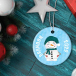 Festive Snowmen Holiday Christmas Ceramic Tree Decoration<br><div class="desc">Enhance your holiday decor with our "Festive Snowmen" Christmas Tree Ornament. This delightful ornament is a charming addition to your festive surroundings, featuring a playful design that encapsulates the enchanting spirit of the Christmas season. The front of the ornament showcases an endearing snowman, snugly dressed in warm winter gear, evoking...</div>