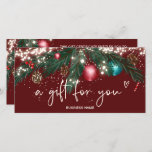 Festive winter wreath logo gift certificate red<br><div class="desc">Modern logo gift certificate with festive Christmas lights green pine branches snow with cute illustration of glitter Christmas ball ornament,  green watercolor pine branches,  mistletoe,  pine cones,  string fairy lights on editable dark red background.. Get ready for the shopping season and Christmas. Perfect gift for anyone! Add your logo.</div>