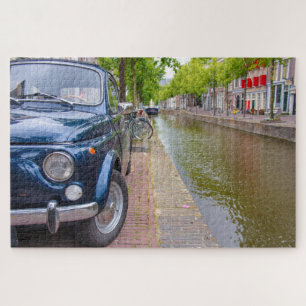 Fiat 500 car on canal, Amsterdam Jigsaw Puzzle