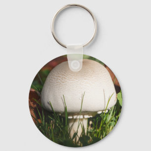 Field mushroom in a forest during autumn key ring