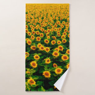 Field with bright yellow sunflowers in sunny day.  bath towel