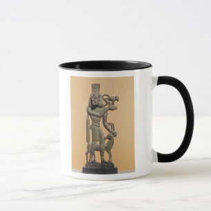 Figure of a man holding a monkey mug