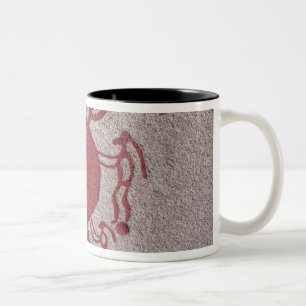 Figures and animals around a sun Two-Tone coffee mug