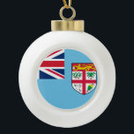 Fiji Flag Ceramic Ball Christmas Ornament<br><div class="desc">The Fijian flag is a light blue ensign with the shield-of-arms in the fly. The used colours in the flag are blue, red, white. The proportion of the Fijian flag is 1:2. The Flag of Fiji was adopted in 1970. The first use of the current flag design was in 1924....</div>