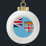 Fiji Flag Ceramic Ball Christmas Ornament<br><div class="desc">The Fijian flag is a light blue ensign with the shield-of-arms in the fly. The used colours in the flag are blue, red, white. The proportion of the Fijian flag is 1:2. The Flag of Fiji was adopted in 1970. The first use of the current flag design was in 1924....</div>