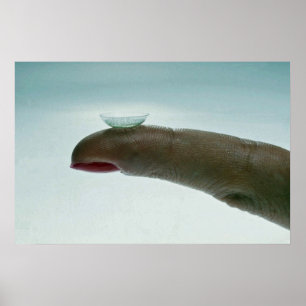 Finger holding a contact lens poster