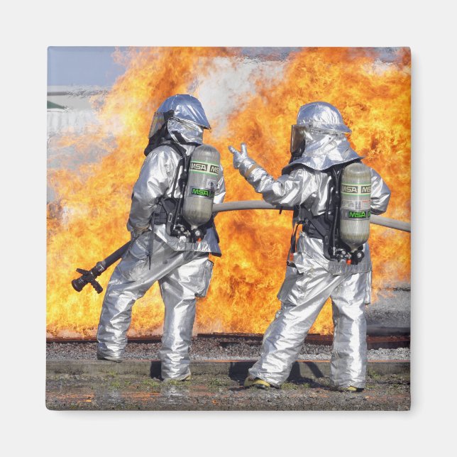 Firefighters battle a simulated fire magnet (Front)