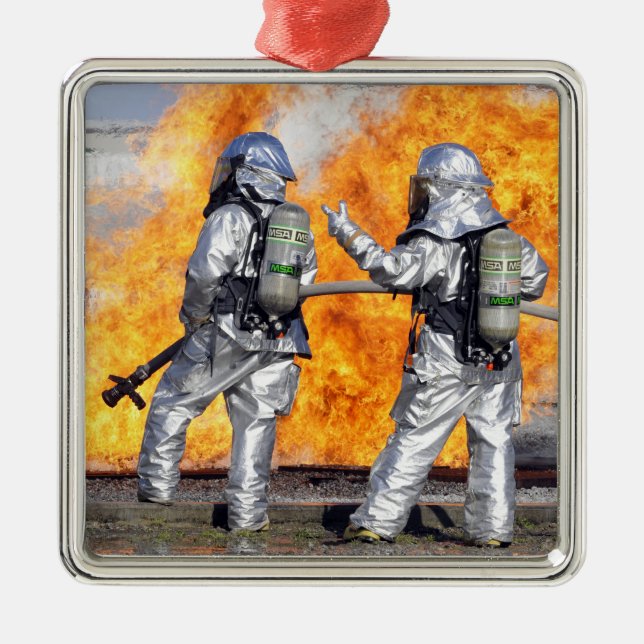 Firefighters battle a simulated fire metal tree decoration (Front)