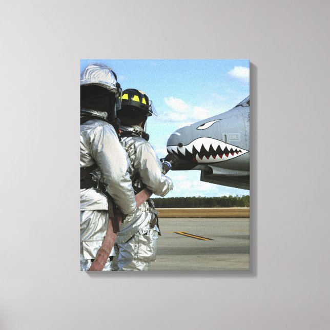 Firefighters deploy a fire hose during a drill canvas print (Front)