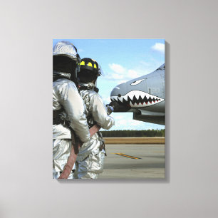 Firefighters deploy a fire hose during a drill canvas print
