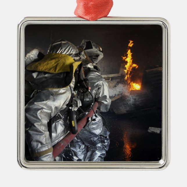 Firefighters extinguish a fire in a training ro metal tree decoration (Front)