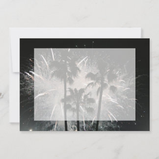 Fireworks behind palm trees