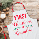 First Christmas as Grandma Apron<br><div class="desc">This Christmas apron is perfect to celebrate the first Christmas as a Grandmother. The wording reads "First Christmas as Grandma" in modern red lettering on a white background.</div>