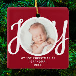 First Christmas As Grandma Photo Keepsake Red  Ceramic Ornament<br><div class="desc">This keepsake "First Christmas As Grandma" photo ornament is decorated with the word 'JOY' in stylish script typography on a red background. Easily customisable.</div>