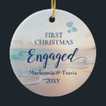 First Christmas Engaged Beach Sunset Ceramic Ornam Ceramic Tree Decoration<br><div class="desc">Keepsake Engagement Ornament with a romantic beach sunset or sunrise over a tropical ocean with turquoise teal blue waves and pink peach sand shoreline with beautiful pastel colours is perfect for the couple who got engaged on a beach or are planning a destination wedding.</div>