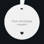 First Christmas Engaged Minimalist Heart Photo Ornament<br><div class="desc">Did you get engaged this year? Add a memory to your tree with this minimalist keepsake acrylic ornament featuring a simple design with the message, "first christmas engaged" along with a heart in black over a white background. The backside has the year over your favourite photo. This modern ornament also...</div>