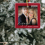 First Christmas Engaged | Photo Christmas Tree Ceramic Ornament<br><div class="desc">Stylish photo christmas tree ornament, for all those loved up couples who have recently got engaged or married. This tree decoration has a berry red border, with text that reads the year, engaged in script font, and the couples names, add your favourite photo then you have the perfect addition to...</div>