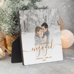 First Christmas Engaged Photo Copper Script Plaque<br><div class="desc">Commemorate your engagement with this beautiful modern keepsake plaque. The copper text reads "Our first Christmas engaged, " with the word "engaged" in elegant faux foil handwriting script with flourishes before and after. Replace the sample image with your favorite photo, and add your names and the year. A white gradient...</div>