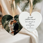 First Christmas Married Modern Minimalist Photo Ceramic Tree Decoration<br><div class="desc">Heart-shaped “Our First Christmas Married” photo ornament is a romantic and sentimental keepsake, perfect for commemorating a couple’s first holiday season as newlyweds. The front features elegant black text in a mix of graceful script and refined serif fonts on a soft white ceramic background, accented with a delicate black heart...</div>