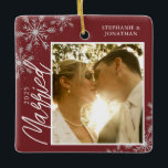 First Christmas Married Red Snowflakes Photo Ceramic Ornament<br><div class="desc">This square Christmas ornament is a perfect gift for the newly married couple. The design features a photo frame with handwritten text "Married" and is accented with light grey snowflakes on a dark red background. Personalise with a pictures of the couple,  their names and year.</div>