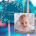 First Hanukkah Baby Snowflakes Stars Grandparents Ceramic Ornament<br><div class="desc">“First Hanukkah.” A playful visual of white Stars of David, snowflakes and handwritten script typography with customised year, overlaying the photo of your choice, help you usher in Hanukkah and New Year. On the back, additional white Stars of David, snowflakes and handwritten typography with “proud grandparents of baby’s name” overlay...</div>