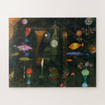 Fish Magic, Paul Klee Abstract Art Jigsaw Puzzle<br><div class="desc">In Fish Magic, Paul Klee creates a magical realm where the aquatic, the celestial, and the earthly intermingle. A delicate black surface covers an underlayer of colours, which the artist revealed by scratching and scrawling designs in the black paint. At the centre of the painting, a square of muslin is...</div>