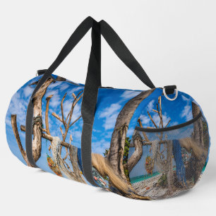Fishing nets drying on the beach duffle bag