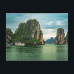 Fishing Village on Ha Long Bay, Vietnam Postcard<br><div class="desc">Photo of a fishing village amid the spectacular limestone rock formations on Ha Long Bay in Vietnam. Ha Long Bay is a UNESCO World Heritage Site and is known for its stunning emerald green waters as well as its ancient fishing villages and rock formations made of limestone.</div>