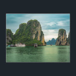 Fishing Village on Ha Long Bay, Vietnam Postcard<br><div class="desc">Photo of a fishing village amid the spectacular limestone rock formations on Ha Long Bay in Vietnam. Ha Long Bay is a UNESCO World Heritage Site and is known for its stunning emerald green waters as well as its ancient fishing villages and rock formations made of limestone.</div>