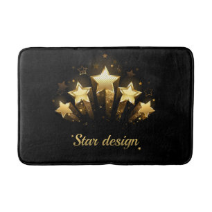 Five gold stars on black bath mat