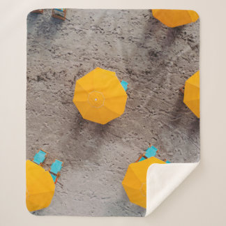 Five yellow umbrellas on sand at daytime sherpa blanket