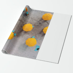 Five yellow umbrellas on sand at daytime wrapping paper