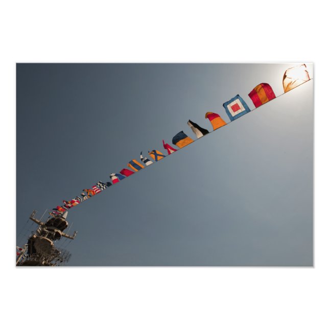 Flags fly over the deck of the USS Iwo Jima Photo Print (Front)