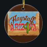 Flagstaff Ornament Arizona Desert Vintage<br><div class="desc">Flagstaff Arizona neo vintage travel design in funny cartoon retro style featuring the desert,  a cactus and rocks. Blue,  brown and red with green cactus.</div>
