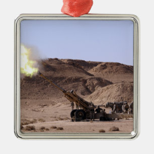 Flame and smoke emerge from the muzzle metal tree decoration