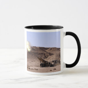 Flame and smoke emerge from the muzzle mug