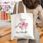 Flamingo Tote Bag<br><div class="desc">The perfect accessory for those who appreciate a blend of simplicity and charm,  this tote bag features an illustration of two pink flamingos in a tender embrace,  symbolising grace,  beauty,  and strength. The elegant script adds a touch of sophistication to your everyday ensemble.</div>