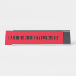 Flare in Progress. Stay back 200 feet. Desk Name Plate