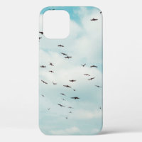 Flock of grey dove fly on vintage blue sky. above,