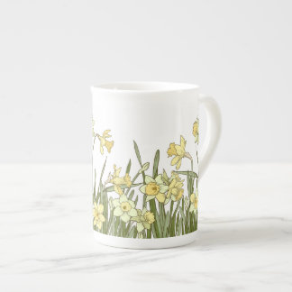 Floral border of yellow daffodils on bone china mug