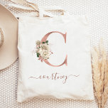 Floral Ivory Rose Gold Monogram Letter C Tote Bag<br><div class="desc">This elegant tote bag features a large letter "C" monogram in faux rose gold foil, decorated with a vintage ivory floral bouquet trimmed with green and rose gold foliage. Personalise it with her name in rose gold handwriting script, with flourishes at the beginning and end. Makes a perfect bridesmaid gift!...</div>