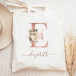Floral Ivory Rose Gold Monogram Letter E Tote Bag<br><div class="desc">This elegant tote bag features a large letter "E" monogram in faux rose gold foil, decorated with a vintage ivory floral bouquet trimmed with green and rose gold foliage. Personalise it with her name in rose gold handwriting script, with flourishes at the beginning and end. Makes a perfect bridesmaid gift!...</div>