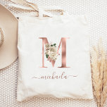 Floral Ivory Rose Gold Monogram Letter M Tote Bag<br><div class="desc">This elegant tote bag features a large letter "M" monogram in faux rose gold foil, decorated with a vintage ivory floral bouquet trimmed with green and rose gold foliage. Personalise it with her name in rose gold handwriting script, with flourishes at the beginning and end. Makes a perfect bridesmaid gift!...</div>