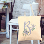 Floral Letter Dusty Blue Personalized Bride Tote Bag<br><div class="desc">Personalized tote bag for the Bride with a capital B, decorated with watercolor flowers. The design has a dusty blue color theme and the name template is set up ready for you to customize it with your name. Perfect for bachelorette weekends, wedding rehearsals and the big day. Coordinatting bags are...</div>