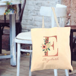 Floral Letter E Pink and Ivory Bouquet Tote Bag<br><div class="desc">Personalized tote bag with your monogram - name and inital. The floral letter E is designed in rose pink glitter and decorated with a pink and ivory bouquet of watercolor flowers and greenery. The template is set up for you to add your name in dusty pink hand lettered script. A...</div>