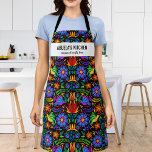 Floral Mexican Pattern Abuela's Kitchen Custom Apron<br><div class="desc">Fun apron featuring a Mexican pattern of colourful flowers, birds and ornaments set against a black background and two lines of custom text. Add a person's name, your Abuela's name, restaurant name, cafe or shop name or delete the text and rectangle and just use the pattern. Perfect for budding chefs,...</div>