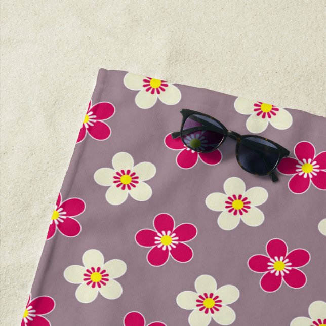 Floral pattern of crimson and white flowers on a c beach towel (In Situ)
