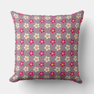 Floral pattern of crimson and white flowers on a c cushion