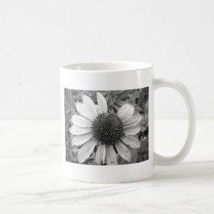 Flower in black and white coffee mug